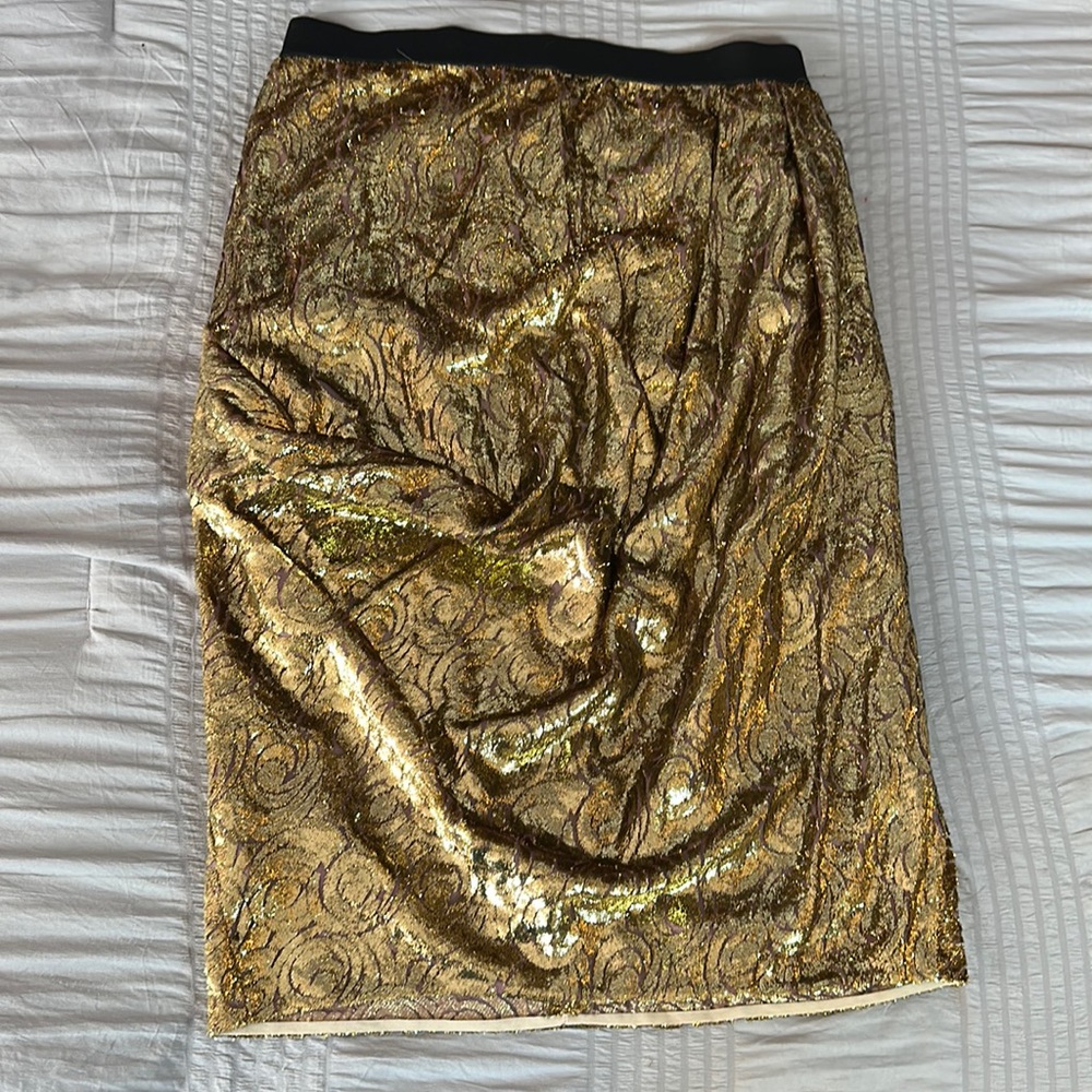 Beautiful gold, soft skirt, knee length with a ruffle on the right side.